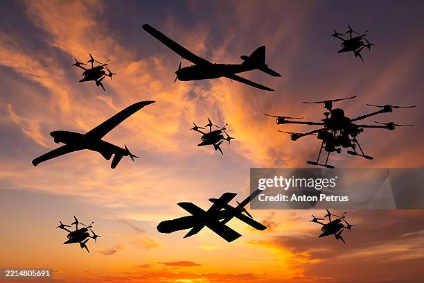 different types of military unmanned aerial vehicles at sunset - military attack stock pictures, royalty-free photos & images