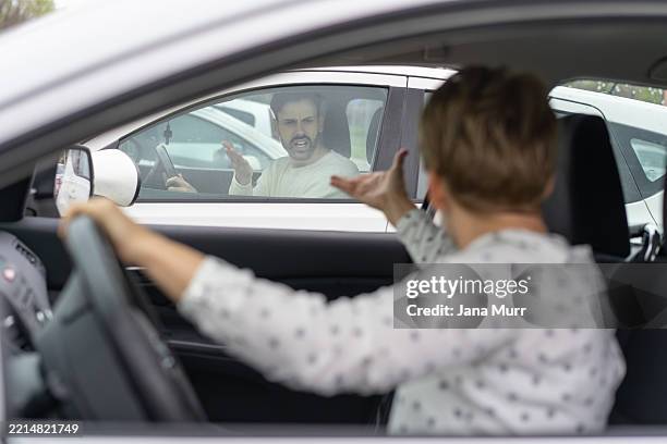 arguments and emotions: a view inside the cars - aggression stock pictures, royalty-free photos & images