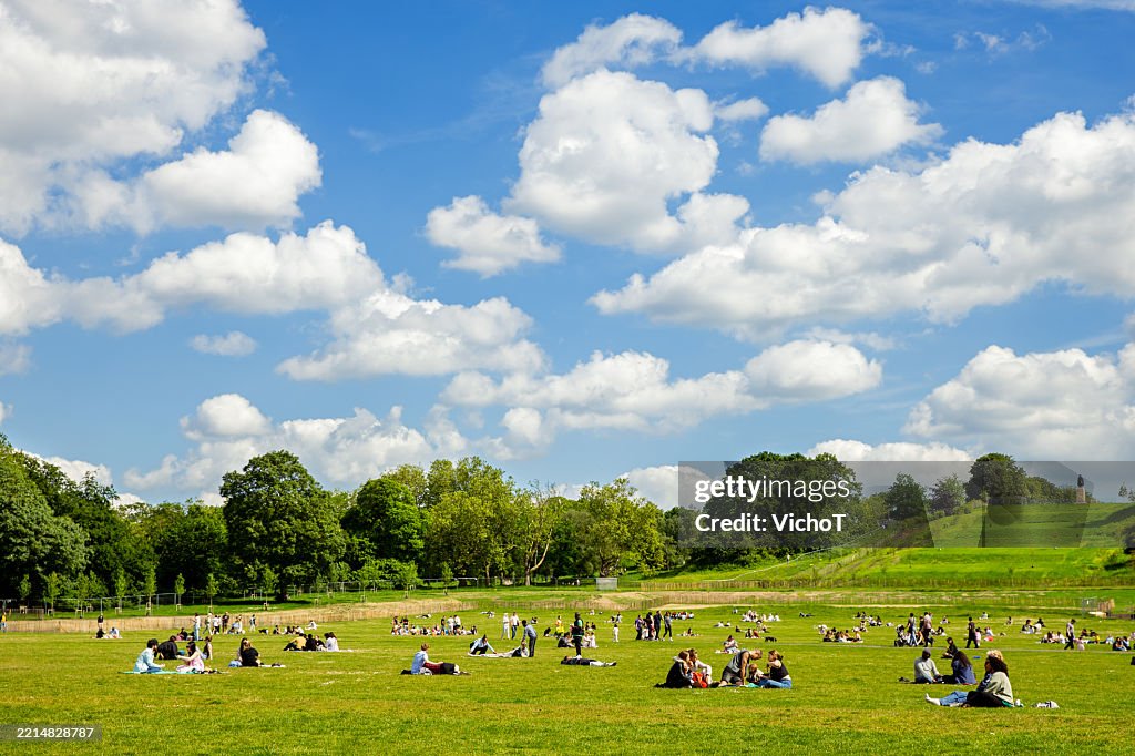 People relaxing on a sunny day at public park
