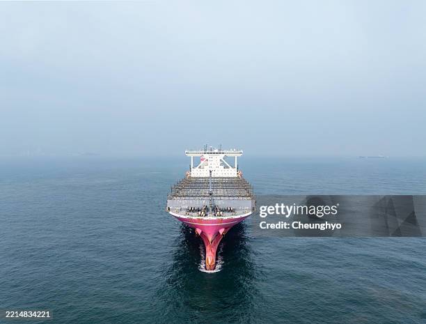 an empty container ship sailing at sea - old ship bow stock pictures, royalty-free photos & images
