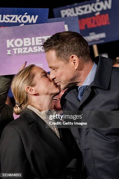 Presidential candidate of the Civic Platform Rafal Trzaskowski kisses his wife Małgorzata Trzaskowska during a rally on the last day of campaigning...