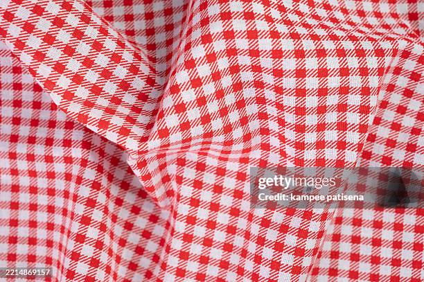 a red plaid patterned fabric with white background - red table cloth stock pictures, royalty-free photos & images