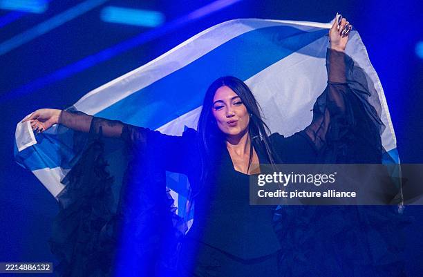 May 2025, Switzerland, Basel: Yuval Raphael from Israel comes on stage with the national flag during a rehearsal for the final show of the 69th...