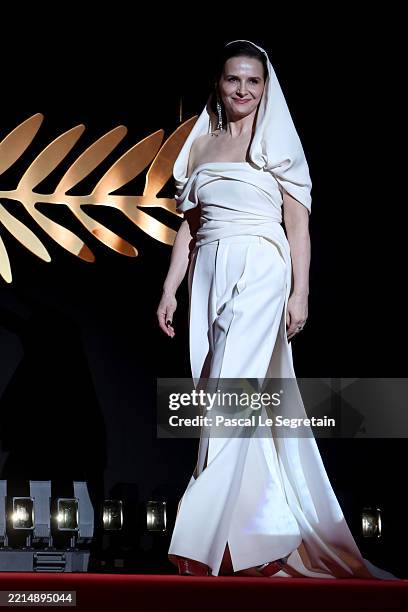 Jury President Juliette Binoche walks onstage during the opening ceremony at the 78th annual Cannes Film Festival at the Palais de Festival on May...