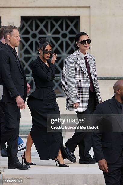 Kim Kardashian and Kris Jenner exit the trial at the Palais de Justice ; Kim Kardashian wears sunglasses by Alaia, a black dress designed as a double...