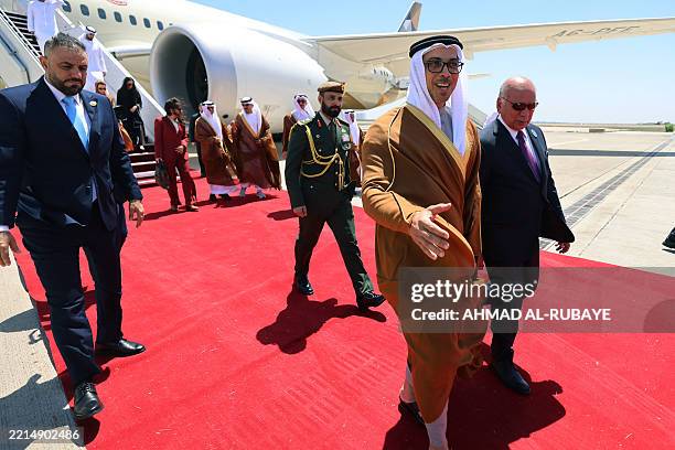 Iraq's Foreign Minister Fuad Hussein welcomes Emirati Vice President and Deputy Prime Minister Sheikh Mansour bin Zayed al-Nahyan as he arrives in...