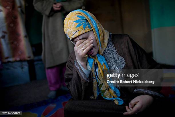 View of Hameeda Nazir cries during an interview, Srinagar, Jammu and Kashmir, India, January 20, 2008. Nazir's husband and brother had both been...