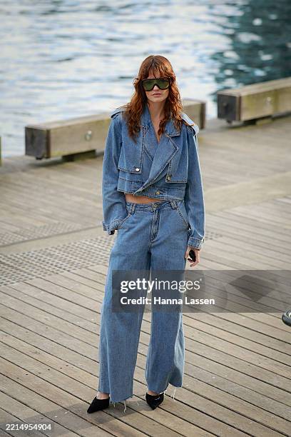 Montana Cox wearing Aje cropped denim jacket and jeans during Australian Fashion Week 2025 on May 14, 2025 in Sydney, Australia.