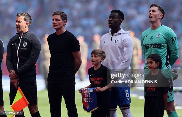 Crystal Palace's Austrian manager Oliver Glasner stnds during the Anthem ahead of the English FA Cup final football match between Crystal Palace and...