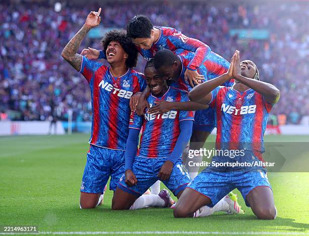 Eberechi Eze of of Crystal Palace celebrates with teammates Chris Richards, Daichi Kamada, Ismaila Sarr and Jean-Philippe Mateta after scoring the...