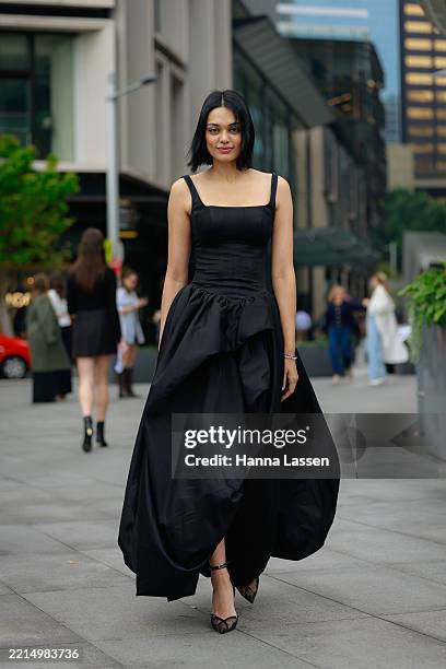 Guest wearing black maxi dress during Australian Fashion Week 2025 on May 14, 2025 in Sydney, Australia.