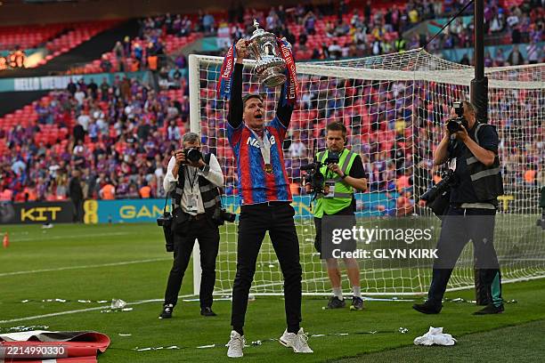 Crystal Palace's Austrian manager Oliver Glasner poses with the trophy after the English FA Cup final football match between Crystal Palace and...