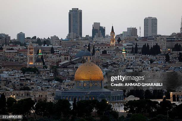This picture taken from Mount of Olives shows Jerusalem's Old City with the Muslim Dome of the Rock mosque and the Christian Church of the Holy...