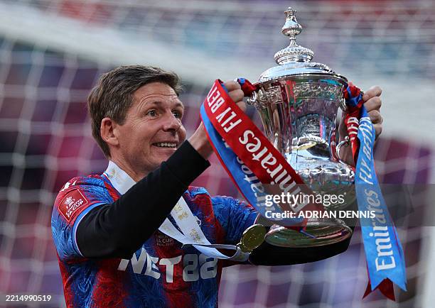 Crystal Palace's Austrian manager Oliver Glasner poses with the trophy after the English FA Cup final football match between Crystal Palace and...