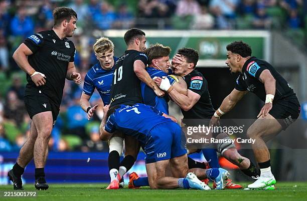 Dublin , Ireland - 17 May 2025; Jordie Barrett of Leinster is tackled by Adam Hastings, left, and Rory Darge of Glasgow Warriors during the United...