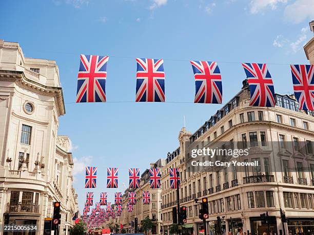 union jack flags hanging over regent street, london - british royal family foto e immagini stock