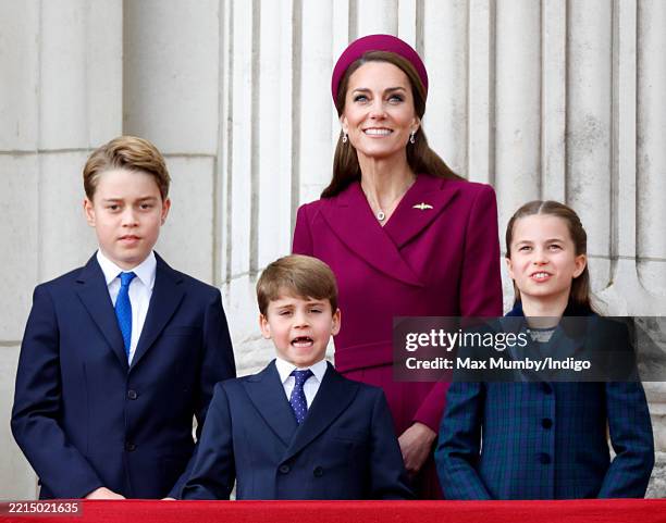 Prince George of Wales, Prince Louis of Wales, Catherine, Princess of Wales and Princess Charlotte of Wales watch a flypast from the balcony of...