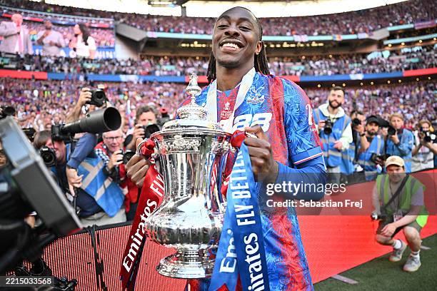 Eberechi Eze of Crystal Palace celebrates with the trophy after winning the Emirates FA Cup Final match between Crystal Palace and Manchester City at...