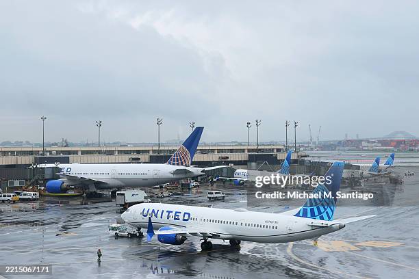 Planes are seen on the tarmac at Newark Liberty International Airport on May 14, 2025 in Newark, New Jersey. A shortage of air traffic controllers...