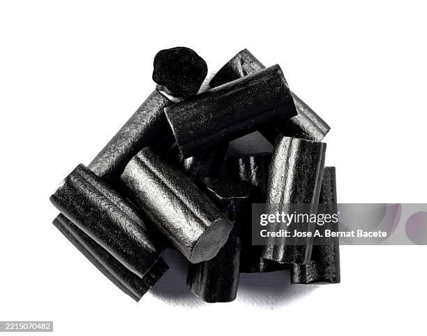 soft licorice candies on a white background. - allsorts stock pictures, royalty-free photos & images