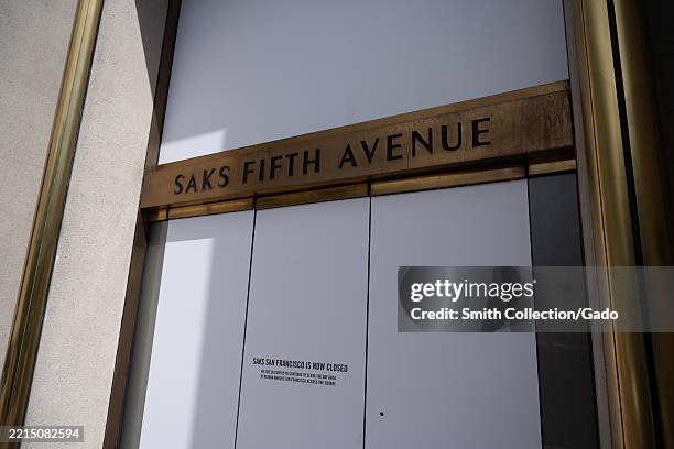 Boarded entrance of Saks Fifth Avenue store displaying closure notice, San Francisco, California, May 13, 2025.