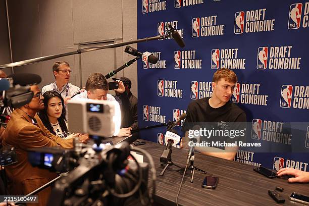 Cooper Flagg answers questions from reporters during media availability at the 2025 NBA Draft Combine at Wintrust Arena on May 14, 2025 in Chicago,...