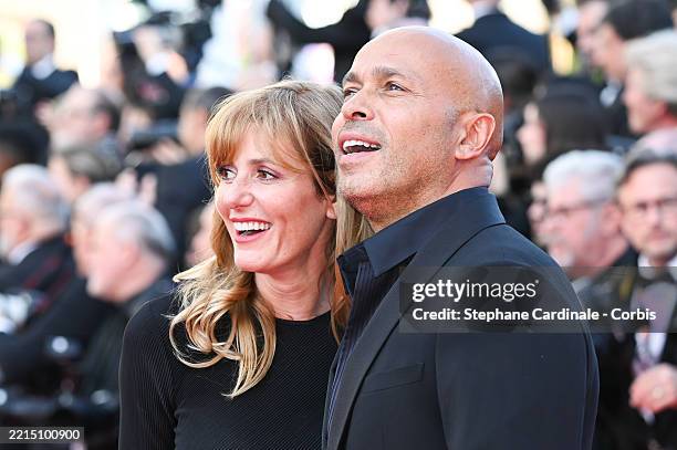 Éric Judor and guest attend the "Mission Impossible - The Final Reckoning" red carpet at the 78th annual Cannes Film Festival at Palais des Festivals...
