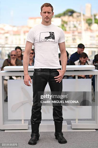Swedish actor Alexander Skarsgard poses during a photocall for the film "Pillion" at the 78th edition of the Cannes Film Festival in Cannes, southern...