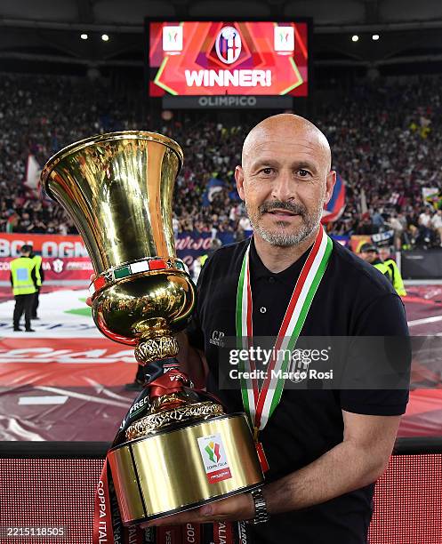 Vincenzo Italiano, Head Coach of Bologna, poses for a photo with the Coppa Italia trophy after the team's victory in the Coppa Italia Final match...