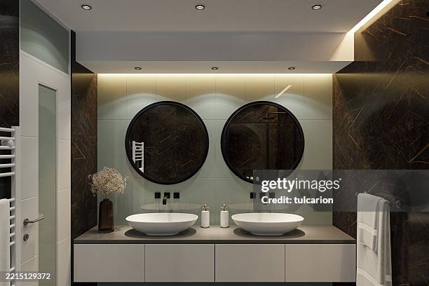 contemporary bathroom with black marble tiles and light green accent wall - vanity stock pictures, royalty-free photos & images