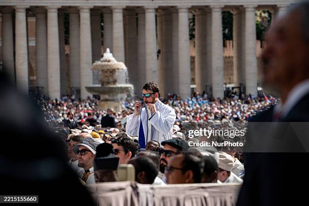 Priest kisses his stole prior to the Inauguration Mass of Pope Leo XIV in St Peter's Square on May 18 in Vatican City, Vatican. Pope Leo XIV presides...
