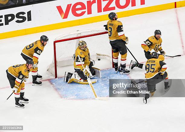 Jack Eichel, Ivan Barbashev, Adin Hill, Brayden McNabb, Shea Theodore and Victor Olofsson of the Vegas Golden Knights react after Kasperi Kapanen of...