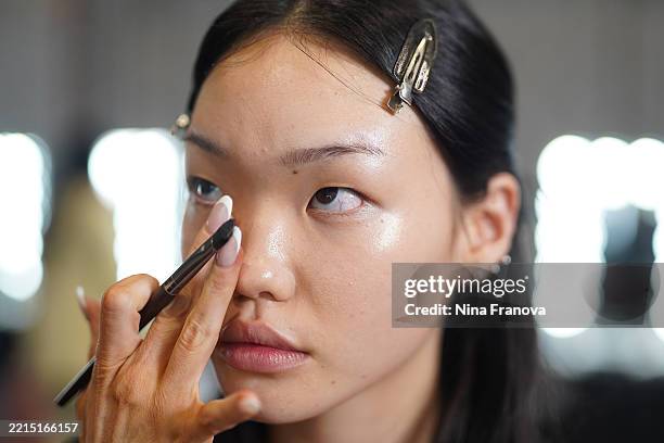 Model prepares backstage ahead of the Gary Bigeni show at Australian Fashion Week 2025 at Carriageworks on May 15, 2025 in Sydney, Australia.