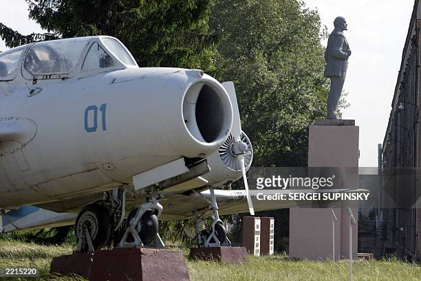 Lenin's monument stays among planes in the open-air museum of Kharkov State Aircraft Manufactoring Company in Kharkiv, East Ukraine, 14 June 2003....