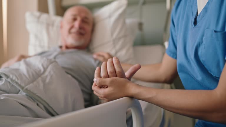 https://media.gettyimages.com/id/2215224817/video/compassionate-nurse-holding-hand-of-elderly-patient.jpg?b=1&s=640x640&k=20&c=TaZuv3Bz1kv_au2yK2lE3al1uAH92Xbw2dKPpy4b54o=