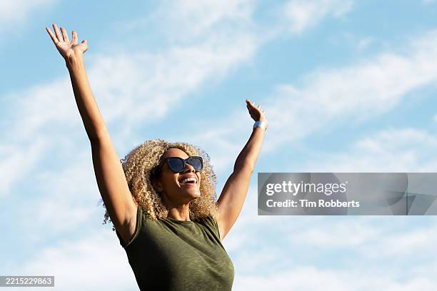 happy woman with her arms in the air - me time stock pictures, royalty-free photos & images