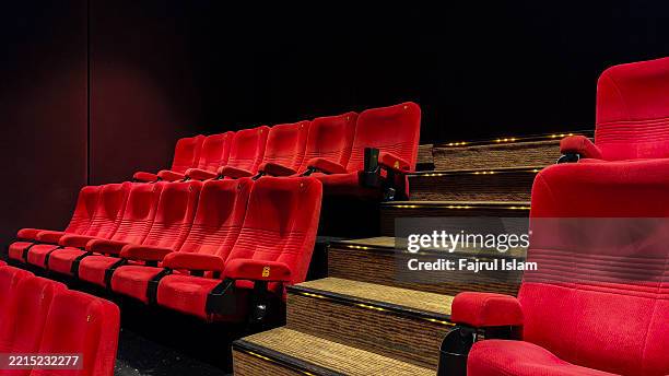 empty theater seats - projection equipment stock pictures, royalty-free photos & images