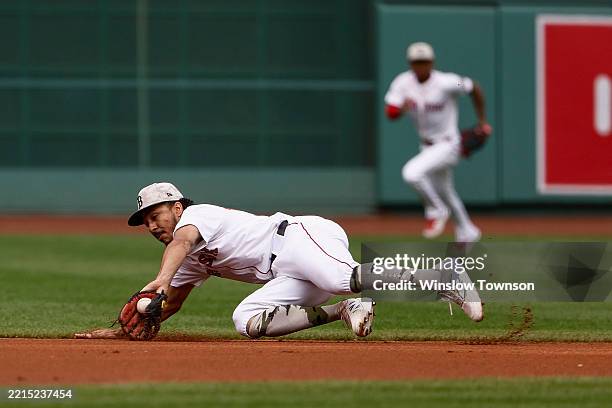 David Hamilton of the Boston Red Sox stops a ground ball but was unable to throw out Austin Riley of the Atlanta Braves on an infield single during...