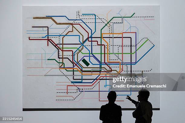 People stand in front of the site-specific installation "Tokyo Diagram", part of the exhibition "ICARUS" by Japanese contemporary artist Yukinori...