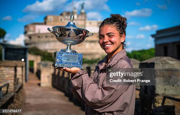 Jasmine Paolini of Italy poses with the champions trophy during the champions photo shoot after defeating Coco Gauff of the United States in the...