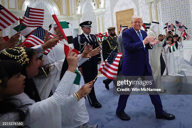 President Donald J. Trump is greeted by young girls as he arrives for an official arrival ceremony at Qasr al Watan May 15 in Abu Dhabi, United Arab...