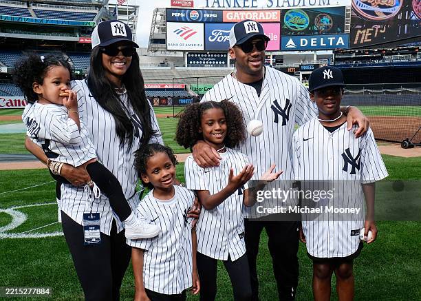 New York Giants Quarterback Russel Wilson and his family pose for a photo prior to the game between the New York Mets and the New York Yankees at...