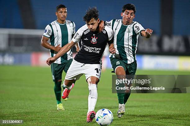 Angel Romero of Corinthians vies for the ball with Lucas Rodríguez of Racing during a match between Racing Montevideo and Corinthians as part of the...