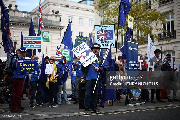Anti-Brexit demonstrator Steve Bray and fellow pro EU activists wave flags as they protest near Lancaster House, the venue of the UK-EU Summit, in...