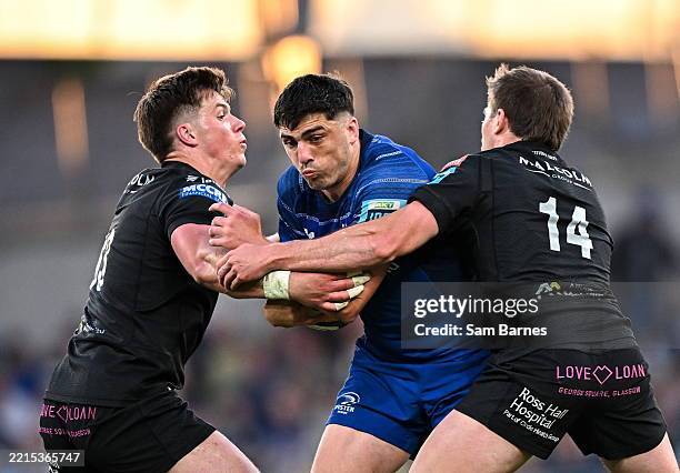 Dublin , Ireland - 17 May 2025; Jimmy O'Brien of Leinster is tackled by, Huw Jones, left, and Sebastian Cancelliere of Glasgow Warriors during the...