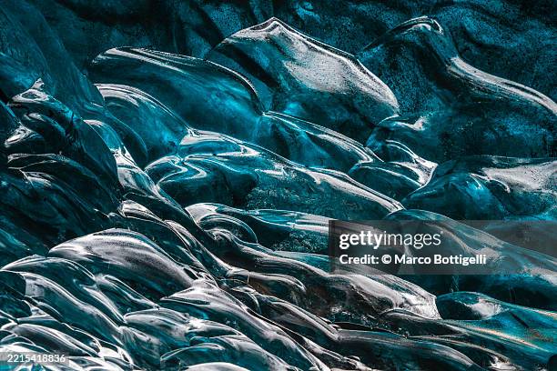intricate blue ice formations inside an icelandic cave showcasing natural beauty and wonder - intricacy stock pictures, royalty-free photos & images