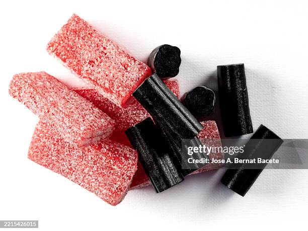 soft licorice candies on a white background. - allsorts stock pictures, royalty-free photos & images