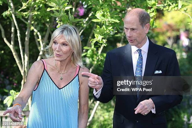 Radio presenter Jo Whiley and Prince Edward, Duke of Edinburgh gesture as they visit the RHS and BBC Radio 2 Dog Garden, at the RHS Chelsea Flower...