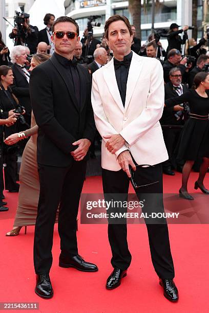 Actor Scott Eastwood and US actor Luke Wilson arrive for the screening of the film "Highest 2 Lowest" at the 78th edition of the Cannes Film Festival...