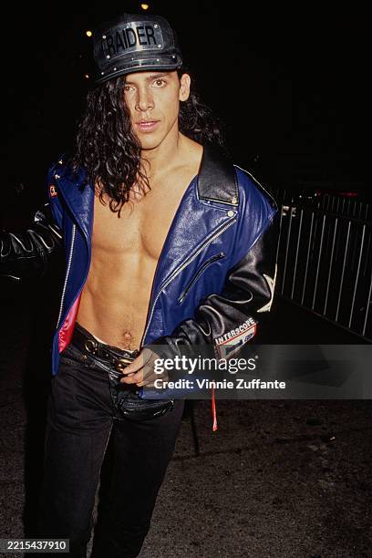 Ecuadorian-born American rapper, singer and actor Gerardo, wearing a black-and-blue leather jacket over a bare torso, attends the Hollywood premiere...